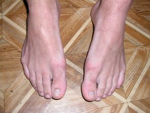 White socks hottie showing off his soles for you