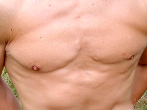 Blond-haired twink hottie posing naked outdoors