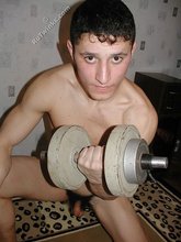 Jacked-up young twink checks himself out in the mirror
