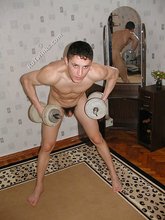Jacked-up young twink checks himself out in the mirror