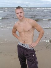 Blond-haired twink flashing his sexy junk on cam