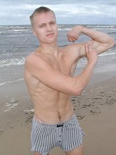 Blond-haired twink flashing his sexy junk on cam