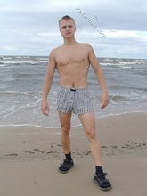Blond-haired twink flashing his sexy junk on cam