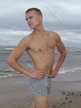 Blond-haired twink flashing his sexy junk on cam