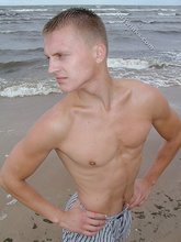 Blond-haired twink flashing his sexy junk on cam