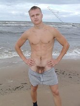 Blond-haired twink flashing his sexy junk on cam