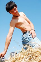 Dark-haired twink posing in the sun, looking sexy