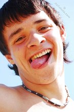 Dark-haired twink posing in the sun, looking sexy