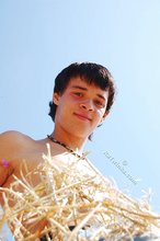 Dark-haired twink posing in the sun, looking sexy