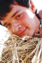 Dark-haired twink posing in the sun, looking sexy