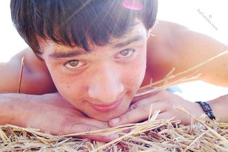 Dark-haired twink posing in the sun, looking sexy