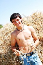 Dark-haired twink posing in the sun, looking sexy