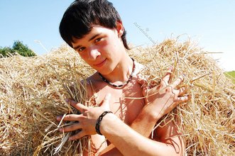 Dark-haired twink posing in the sun, looking sexy