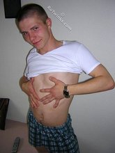 Kinky bald-headed twink putting his clothes back on