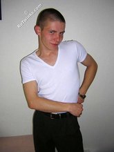 Kinky bald-headed twink putting his clothes back on