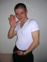 Kinky bald-headed twink putting his clothes back on