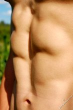 Shredded young boy shows off his beautiful abs