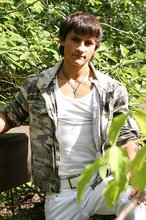 Dark-haired young boy shows off his ass and then some