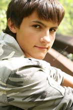 Dark-haired young boy shows off his ass and then some