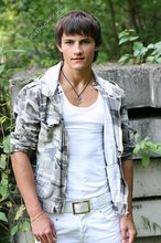 Dark-haired young boy shows off his ass and then some