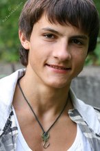 Dark-haired young boy shows off his ass and then some