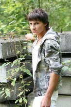 Dark-haired young boy shows off his ass and then some