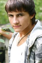 Dark-haired young boy shows off his ass and then some