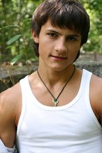 Dark-haired young boy shows off his ass and then some