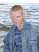 Muscly redheaded twink posing by the river