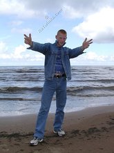 Muscly redheaded twink posing by the river
