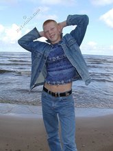 Muscly redheaded twink posing by the river