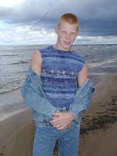 Muscly redheaded twink posing by the river