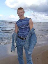 Muscly redheaded twink posing by the river