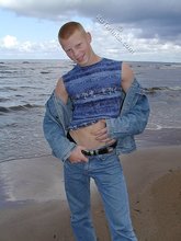 Muscly redheaded twink posing by the river