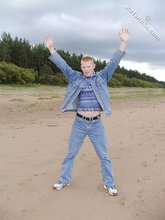 Muscly redheaded twink posing by the river