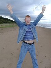 Muscly redheaded twink posing by the river