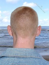 Muscly redheaded twink posing by the river
