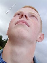 Muscly redheaded twink posing by the river