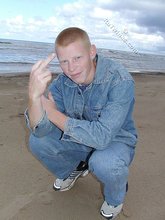 Muscly redheaded twink posing by the river