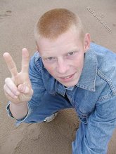 Muscly redheaded twink posing by the river