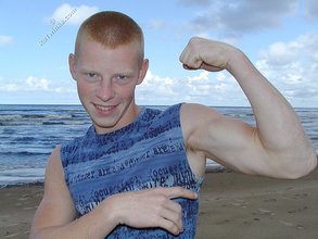 Muscly redheaded twink posing by the river