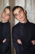 Twink with killer sideburns shows off his fave t-shirt