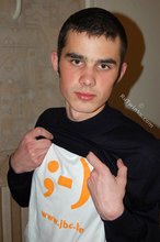 Twink with killer sideburns shows off his fave t-shirt