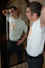 Twink with killer sideburns shows off his fave t-shirt