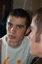 Twink with killer sideburns shows off his fave t-shirt