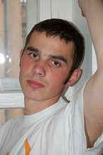 Twink with killer sideburns shows off his fave t-shirt