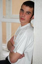 Twink with killer sideburns shows off his fave t-shirt