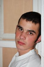 Twink with killer sideburns shows off his fave t-shirt