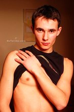 Delicious twink shows off his beautiful body in a doorway