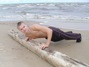 Jacked-up blonde twink doing push-ups outdoors